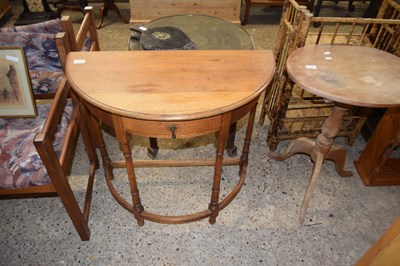 Lot 395 - Early 20th Century oak demi lune hall table...