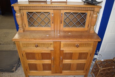 Lot 407 - A 20th Century light oak court cupboard with...