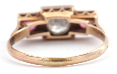 Lot 33 - A ruby and diamond ring, the central round...