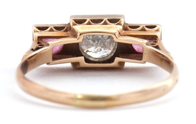 Lot 33 - A ruby and diamond ring, the central round...