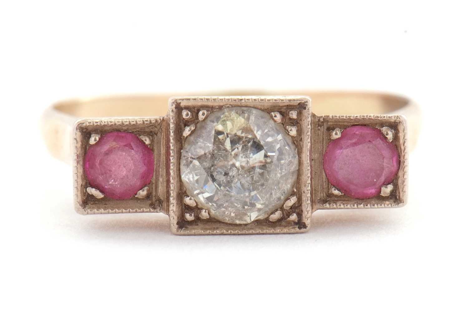 Lot 33 - A ruby and diamond ring, the central round...