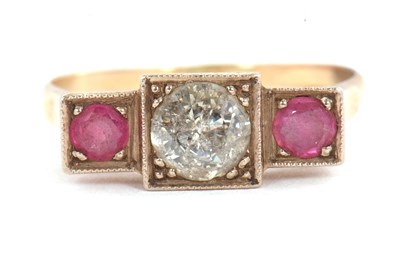 Lot 33 - A ruby and diamond ring, the central round...