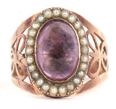 Lot 42 - An amethyst and seed pearl ring, the oval...