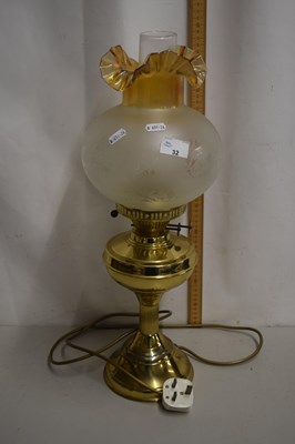 Lot 32 - A brass oil lamp converted to electricity