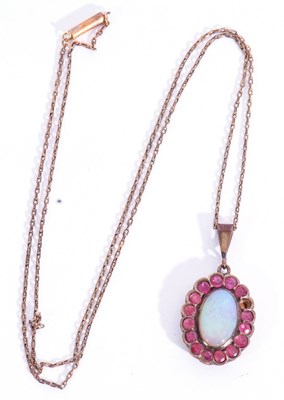 Lot 232 - Opal and ruby pendant, the oval cabochon opal...