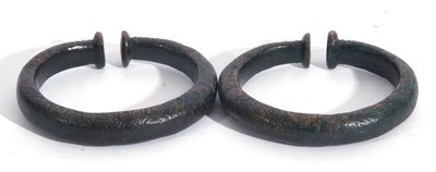 Lot 243 - Pair of bronzed metal torc bracelets with...