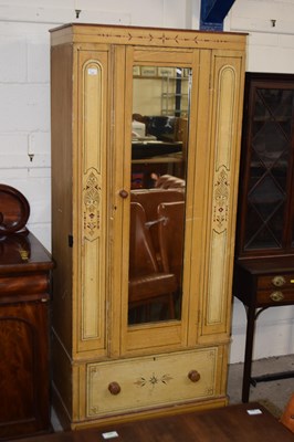 Lot 217 - A Victorian mirror door wardrobe with painted...