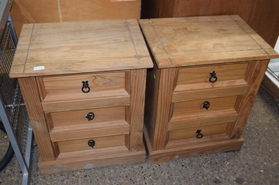 Lot 286 - A pair of pine three drawer bedside cabinets