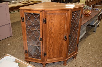 Lot 288 - 20th Century oak corner cabinet with lead...