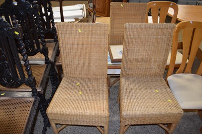 Lot 310 - Three wicker dining chairs and a further cane...