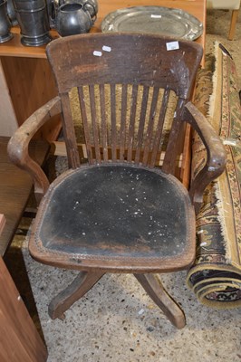 Lot 321 - An early 20th Century oak desk chair