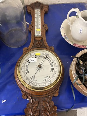 Lot 528 - An early 20th Century oak barometer and...