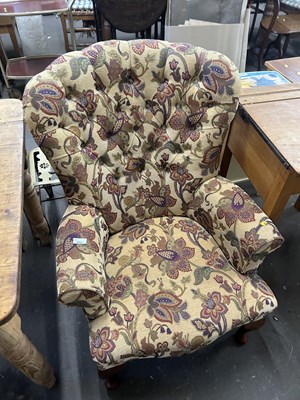 Lot 633 - A floral upholstered button back armchair