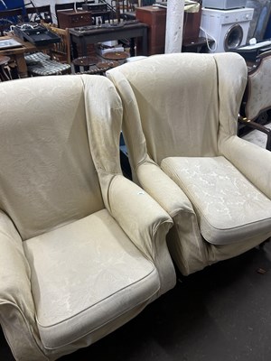 Lot 635 - Pair of wingback armchairs