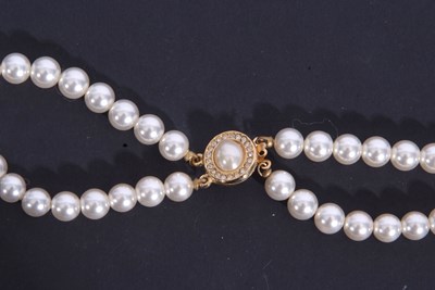 Lot 306 - Double row of simulated pearls of uniform size,...