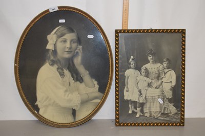 Lot 185 - A large oval framed portrait photograph of a...