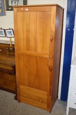 Lot 233 - A pine single door wardrobe