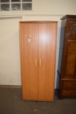 Lot 608 - A teak finish two drawer wardrobe