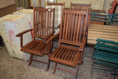 Lot 319 - Four teak framed garden chairs