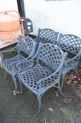 Lot 781 - Four cast metal garden chairs with mesh work...