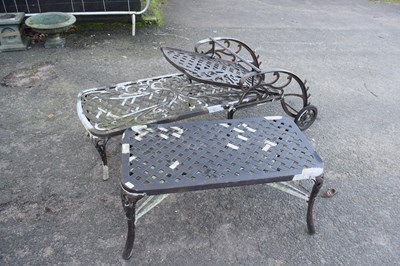 Lot 785 - A cast aluminium sun lounger and table