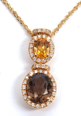 Lot 72 - An 18ct smokey quartz, citrine and diamond...