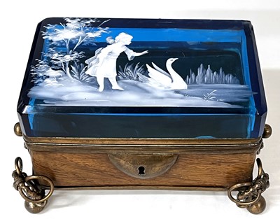 Lot 300 - A wooden box with metal handles, the blue...