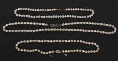 Lot 278 - Three single strand cultured pearl necklaces,...