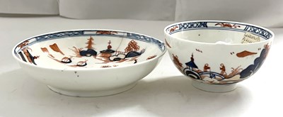 Lot 430 - A Lowestoft porcelain tea bowl and saucer in...