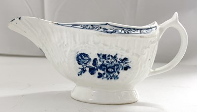 Lot 440 - A Lowestoft porcelain sauce boat, the moulded...