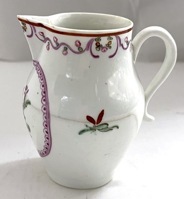 Lot 451 - A Lowestoft porcelain creamer of barrel shape...