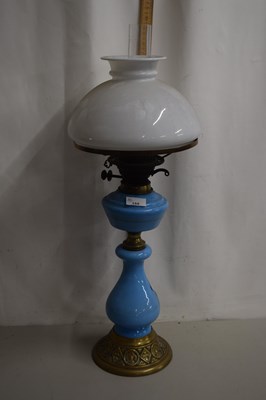 Lot 155 - An oil lamp with pale blue base