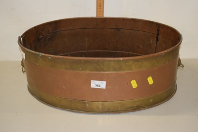 Lot 191 - An oval copper and brass planter