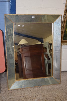 Lot 239 - A large modern rectangular wall mirror with...