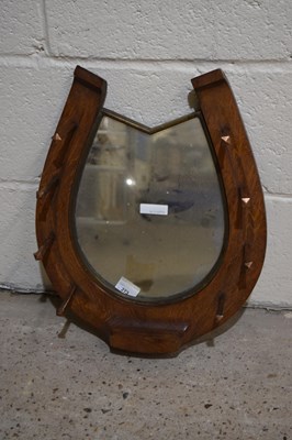 Lot 273 - A horseshoe shaped oak coat rack with mirrored...