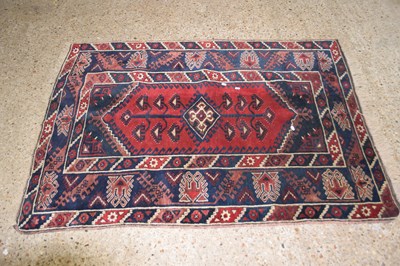 Lot 277 - Small Middle Eastern patterned rug