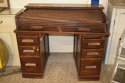 Lot 312 - A vintage roll top twin pedestal desk