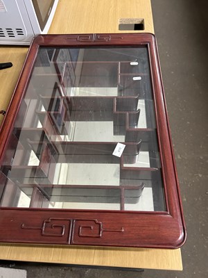 Lot 615 - Modern Oriental hardwood mirror back display...