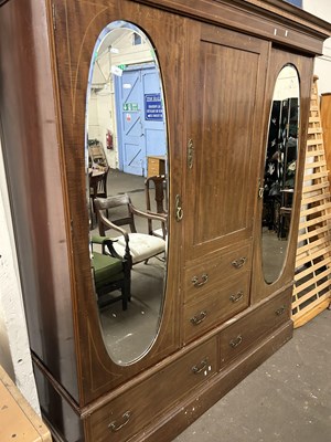 Lot 627 - An Edwardian mahogany wardrobe with oval...