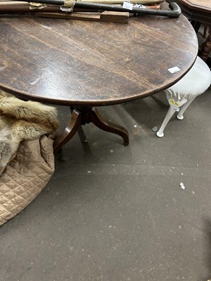 Lot 671 - Georgian oak supper table with turned column...