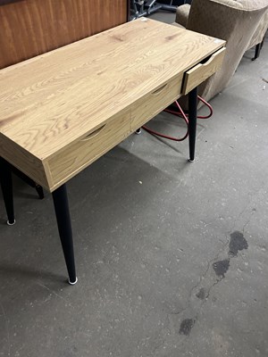 Lot 683 - An oak effect modern desk