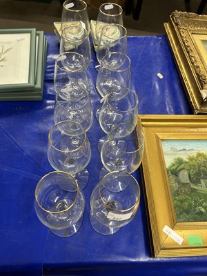 Lot 557 - A suite of gilt rimmed wine glasses