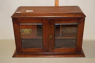 Lot 182 - Late Victorian oak smokers cabinet with glazed...