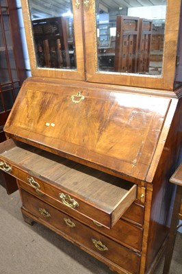 Lot 538 - An early Georgian walnut bureau bookcase with...