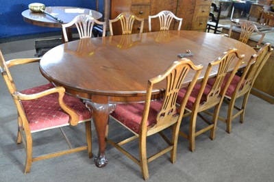 Lot 558 - An Edwardian mahogany extending dining table...