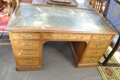 Lot 561 - An Edwardian mahogany twin pedestal desk by...