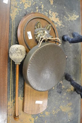 Lot 562 - A brass dinner gong with oak back and fox head...