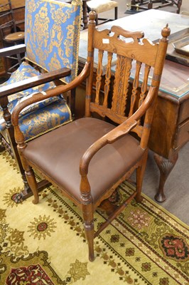 Lot 565 - A late 19th Century oak framed carver chair...