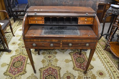 Lot 569 - A small Georgian mahogany tambour front desk...