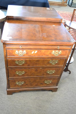 Lot 592 - A reproduction walnut veneered four drawer...